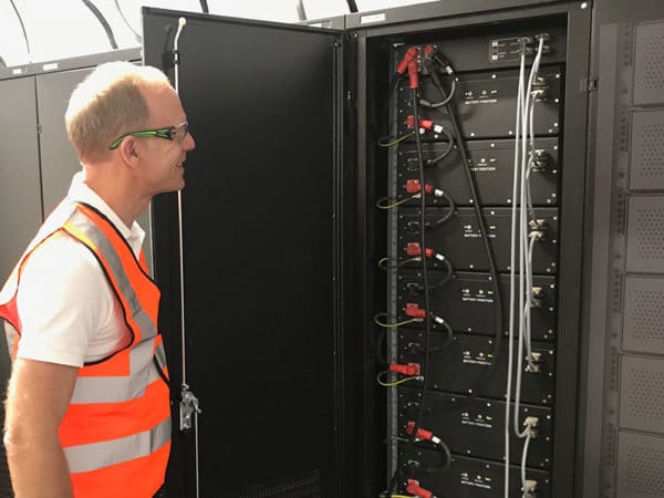 Hans Eric Melin inspecting second life batteries from Nissan Leaf at an Eaton plant in South Africa