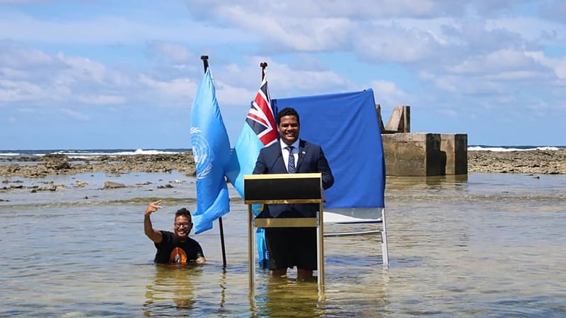 Simon Kofe – the foreign affairs minister for Tuvalu delivered a speech knee deep in water